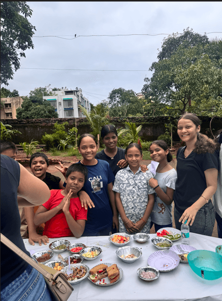 Leo Club of Juhu members and kids enjoying food together at the What's Inside Your Plate event