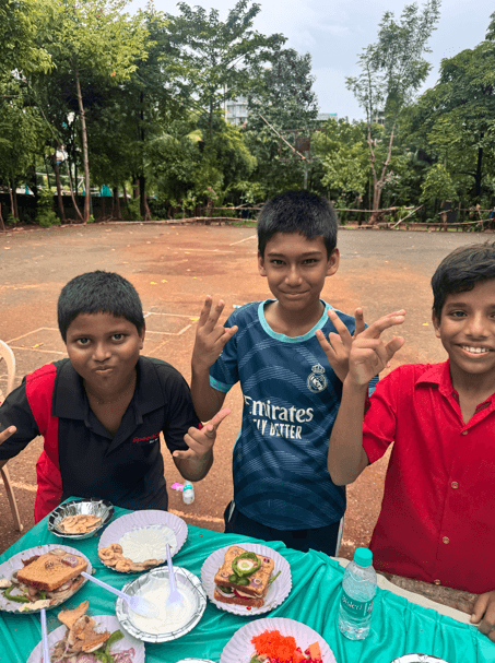 Children smiling with their decorated dishes